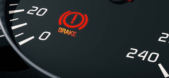 what causes brake light on dash to stay on